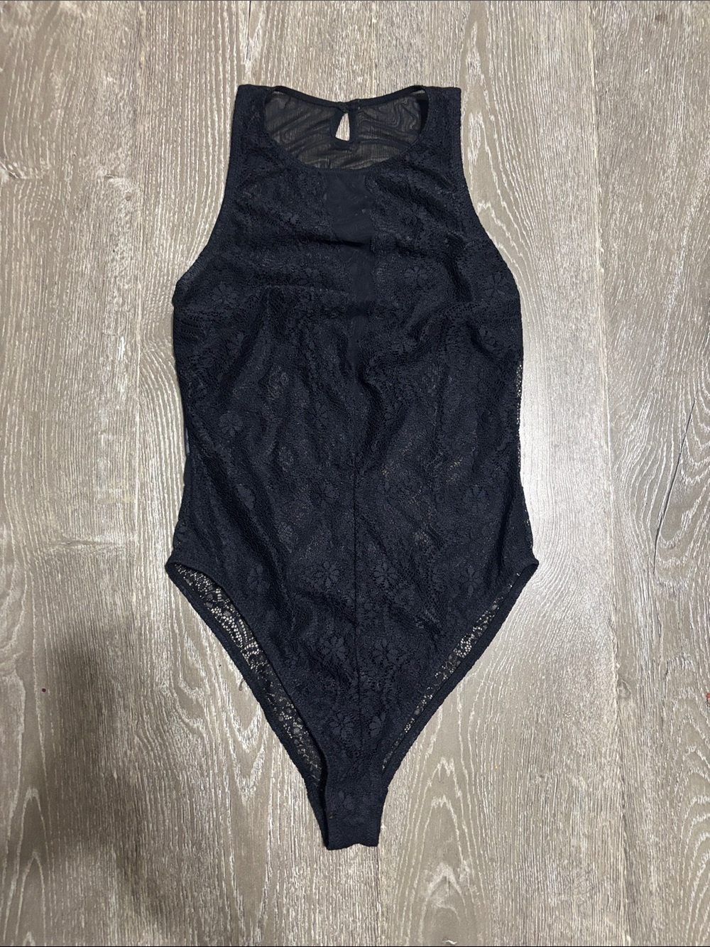 Forever 21 sleeveless bodysuit featuring a floral lace pattern